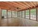 Bright sunroom featuring wood floors, wood ceiling, and windows with backyard views at 2042 Dogwood Rd, Charleston, SC 29414