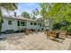Spacious outdoor patio features a cooking station, ample seating, and backyard landscaping at 210 S Gum St, Summerville, SC 29483