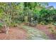 Stone path leading to garden bench at 210 S Gum St, Summerville, SC 29483