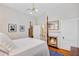 Cozy bedroom featuring a four-poster bed and fireplace at 210 S Gum St, Summerville, SC 29483