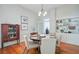 Formal dining area with a wood table, decor, and open built-in shelves showcasing a clean aesthetic at 210 S Gum St, Summerville, SC 29483