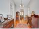 Charming foyer featuring hardwood floors, antique furniture, and a view into the dining room at 210 S Gum St, Summerville, SC 29483