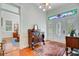 Elegant foyer featuring hardwood floors, stained glass door accents, and classic decor at 210 S Gum St, Summerville, SC 29483