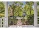 View from the porch showing the landscaped front yard and neighborhood at 210 S Gum St, Summerville, SC 29483