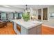 Kitchen featuring stainless steel appliances and a large island with counter seating at 210 S Gum St, Summerville, SC 29483