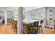 Large kitchen island with marble counters, stainless steel appliances, and natural light at 210 S Gum St, Summerville, SC 29483