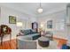 Cozy living room with a comfortable sofa, decorative chairs, and charming decor for relaxed living at 210 S Gum St, Summerville, SC 29483