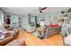 Bright living room with hardwood floors, built-in shelves, and large windows, creating an airy atmosphere at 210 S Gum St, Summerville, SC 29483