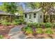 Charming outbuilding or shed with a stone path, adding character and functionality to the property at 210 S Gum St, Summerville, SC 29483