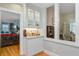 Stylish wet bar area with glass cabinets, granite counters and convenient access to other rooms at 210 S Gum St, Summerville, SC 29483