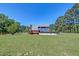 Large backyard with a pool, back deck, horse paddock, and ample green space at 2102 Williams Rd, Ruffin, SC 29475