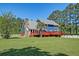 Backyard view of home with wooden deck and above ground pool at 2102 Williams Rd, Ruffin, SC 29475