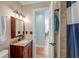 Bathroom features a vanity and shower with a peek into the dining room at 2102 Williams Rd, Ruffin, SC 29475