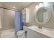 Bathroom featuring a tub/shower combo, vanity, and decorative mirror at 2102 Williams Rd, Ruffin, SC 29475