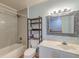Bathroom featuring vanity, bathtub and shower, toilet, and unique mirror at 2102 Williams Rd, Ruffin, SC 29475