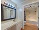 Bathroom with marble countertops and a bathtub with shower in the background at 2102 Williams Rd, Ruffin, SC 29475