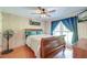 Bedroom features wood-paneled walls, hardwood floors, and natural light at 2102 Williams Rd, Ruffin, SC 29475
