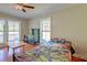Bright bedroom featuring dinosaur-themed bedding, hardwood floors and natural light at 2102 Williams Rd, Ruffin, SC 29475