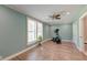 Bonus room with great natural light, ceiling fan, and wood laminate floors at 2102 Williams Rd, Ruffin, SC 29475