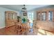 Charming dining room with wooden furniture, natural light, and warm wood floors at 2102 Williams Rd, Ruffin, SC 29475