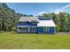 Charming two-story home with a well-manicured front yard and white picket fence at 2102 Williams Rd, Ruffin, SC 29475