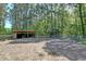 Equestrian property featuring a barn and riding area with fencing at 2102 Williams Rd, Ruffin, SC 29475