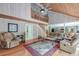 Bright living room with high ceilings, wooden floors, comfortable furniture and stairs to a loft area at 2102 Williams Rd, Ruffin, SC 29475