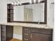 Bathroom sink with granite countertops, storage cabinets and drawers and large vanity mirror with lighting at 2159 Spoleto Ln # E, North Charleston, SC 29406
