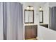 Bathroom featuring a vanity with granite countertop, framed mirror, and shower with curtain at 2159 Spoleto Ln # E, North Charleston, SC 29406