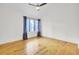Light and airy bedroom with hardwood floors, ceiling fan, and large window at 2159 Spoleto Ln # E, North Charleston, SC 29406