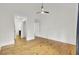 Spacious bedroom with hardwood floors, ceiling fan, and multiple doorways at 2159 Spoleto Ln # E, North Charleston, SC 29406