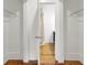 Spacious walk-in closet with hardwood floors features direct access to the ensuite bathroom for added convenience at 2159 Spoleto Ln # E, North Charleston, SC 29406