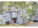 Charming gray townhouse featuring a striking red front door and distinctive arched window at 2159 Spoleto Ln # E, North Charleston, SC 29406