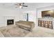 Bright and open living space with fireplace, kitchen bar, and access to the outdoors at 2159 Spoleto Ln # E, North Charleston, SC 29406