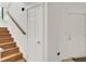 Bright staircase with wooden steps and white walls leads to the next level of the home at 2159 Spoleto Ln # E, North Charleston, SC 29406