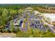 Overhead perspective showcasing the exterior of a commercial property, parking area, and surrounding green spaces at 2290 Deer Sight Way, Mount Pleasant, SC 29466