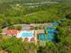 Aerial view of a community clubhouse, pool, playground, and sporting courts at 2290 Deer Sight Way, Mount Pleasant, SC 29466