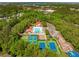 An aerial view of a community with a pool, playground, tennis, pickleball, and basketball courts at 2290 Deer Sight Way, Mount Pleasant, SC 29466