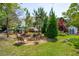Relaxing backyard featuring a charming fire pit area and a lush green lawn at 2290 Deer Sight Way, Mount Pleasant, SC 29466