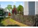 Fenced backyard featuring a shed, vibrant tree, and space for gardening or recreation at 2290 Deer Sight Way, Mount Pleasant, SC 29466