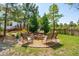 Charming fire pit area with seating and landscaping, perfect for cozy outdoor gatherings at 2290 Deer Sight Way, Mount Pleasant, SC 29466