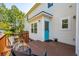 Exterior showcasing a charming back deck with a bright blue door and garden accessories at 2290 Deer Sight Way, Mount Pleasant, SC 29466