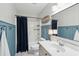 Bathroom features modern fixtures, wainscoting, and shower with curtain at 2290 Deer Sight Way, Mount Pleasant, SC 29466