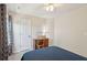 Comfortable bedroom featuring neutral walls, a ceiling fan, and a quaint wooden desk area at 2290 Deer Sight Way, Mount Pleasant, SC 29466