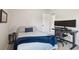 Well-lit bedroom features a sleek desk setup, calming wall color, and modern decor at 2290 Deer Sight Way, Mount Pleasant, SC 29466
