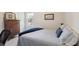 Cozy bedroom boasts a large window, soft lighting, and dark wood furniture at 2290 Deer Sight Way, Mount Pleasant, SC 29466