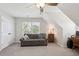 Sloped ceiling bonus room features a comfortable sofa and study area at 2290 Deer Sight Way, Mount Pleasant, SC 29466