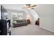 Attic bonus room featuring sloped ceiling, daybed, and work space at 2290 Deer Sight Way, Mount Pleasant, SC 29466