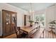 Dining room featuring hardwood floors, built-in cabinets and a large dining table at 2290 Deer Sight Way, Mount Pleasant, SC 29466