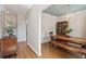 View of the dining room with hardwood floors, an eye-catching light fixture, and paneled walls at 2290 Deer Sight Way, Mount Pleasant, SC 29466